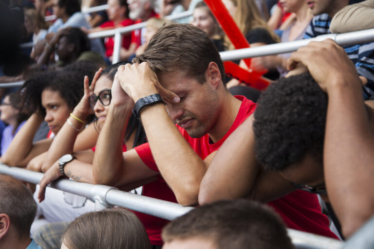 Spectators watching football match